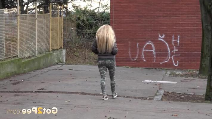 15P Blonde girl Jena Lovely pulls down ripped pants to pee on a public street