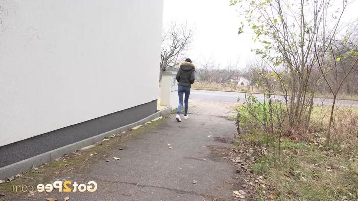15P Brunette girl Mistika gets caught with her pants down while peeing on a road