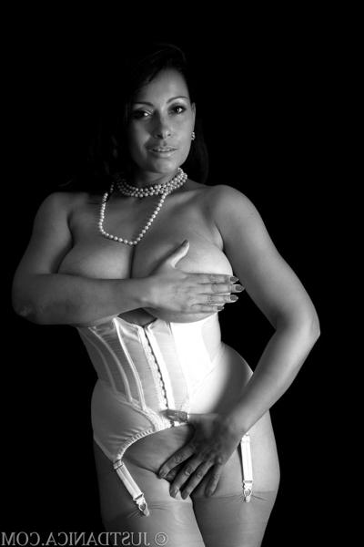 20P Glamorous cougar with big juggs Danica Collins poses in her corset & stockings