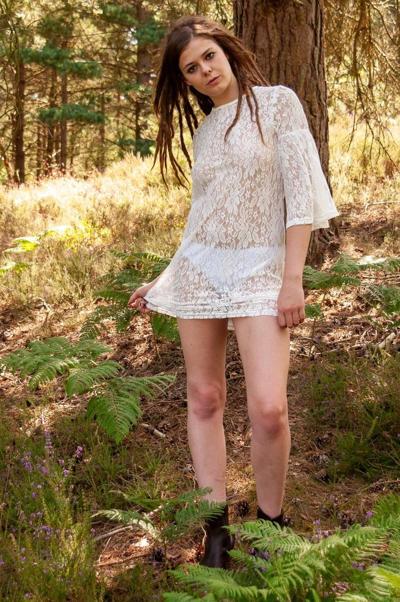 20P Sexy babe flashes her tight ass while teasing in a short dress outdoors