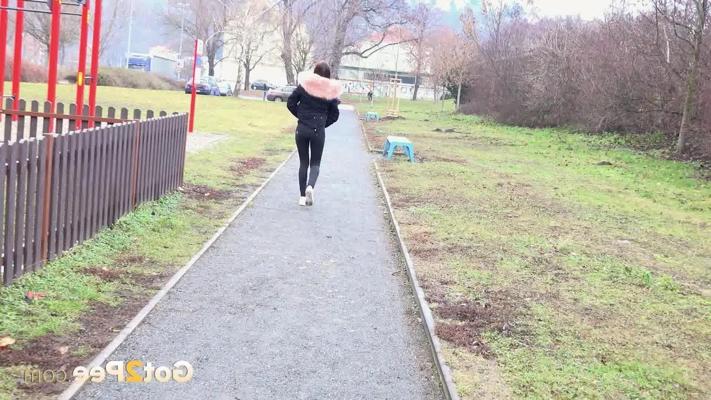 15P Caucasian girl Katy Sky ducks behind a picket fence for a badly needed pee