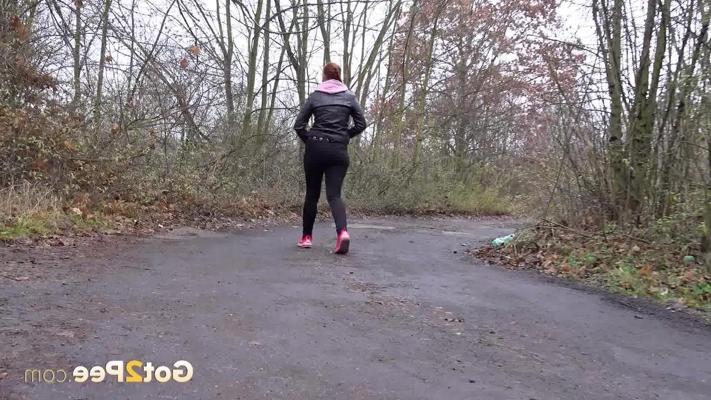 15P Pale redhead Redfox takes a piss on a rural road during a dull day