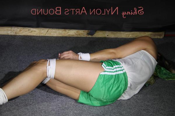 16P White girl is fitted with a gag while bound in shiny nylon gym shorts