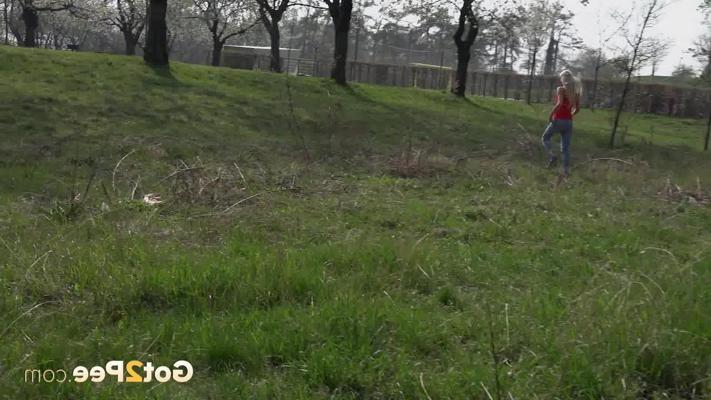 15P Pretty blonde Claudia Macc pulls down ripped jeans to pee up against a rock