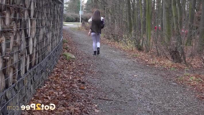 15P Caucasian girl Lara Fox pulls down her pants to pee on a stone dust path
