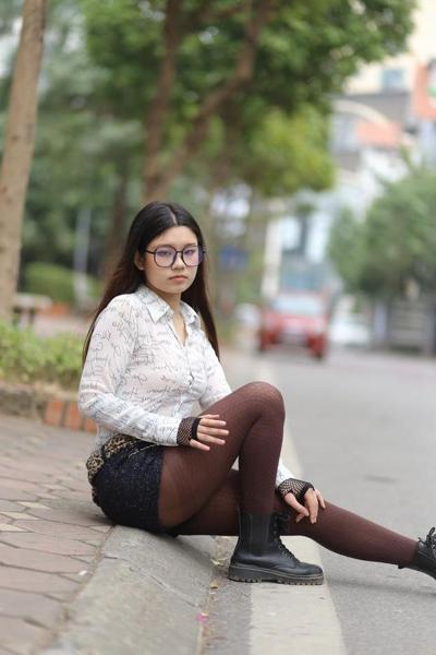 20P Nerdy Asian babe Natalia posing in her white blouse and denim shorts outside