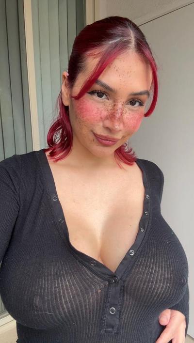 20P Redheaded honey Angel reveals her massive breasts and huge nips up close