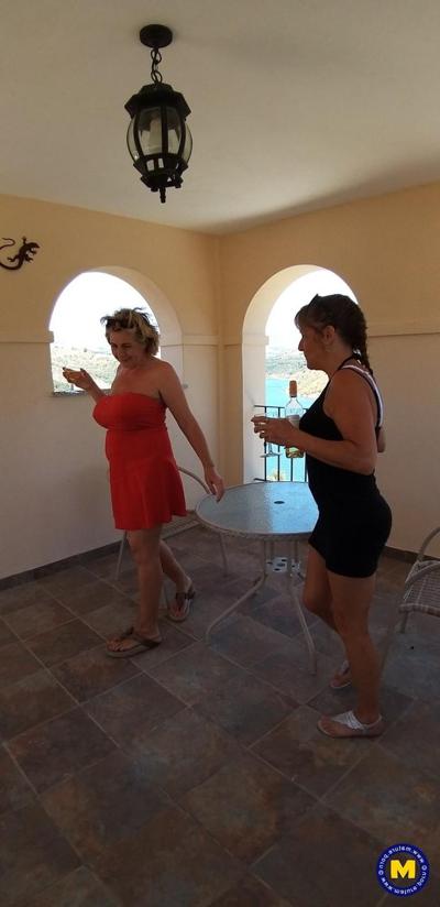20P Curvaceous mature lesbians Camilla C & Pandora drinking wine on vacation