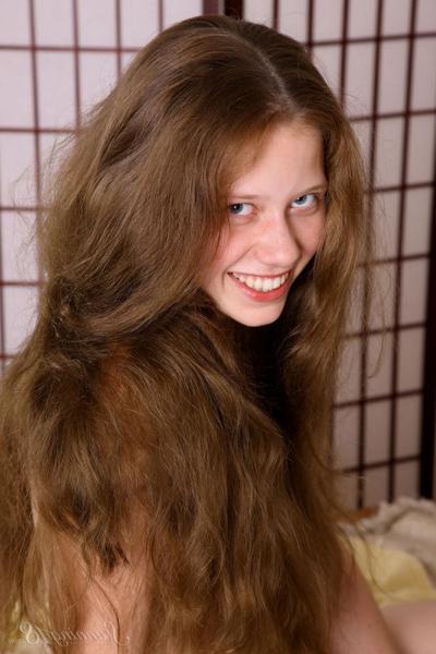 16P Tiny solo girl with long hair models in the nude at the tender age of 18