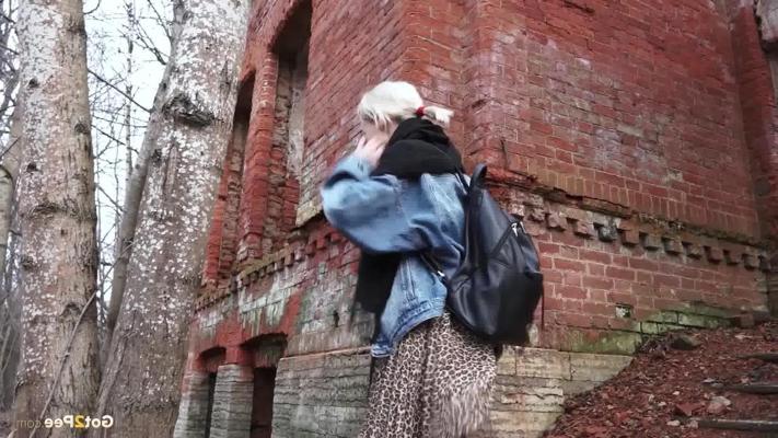 15P Pretty blonde Masha pulls down her tights for a piss by an abandoned building