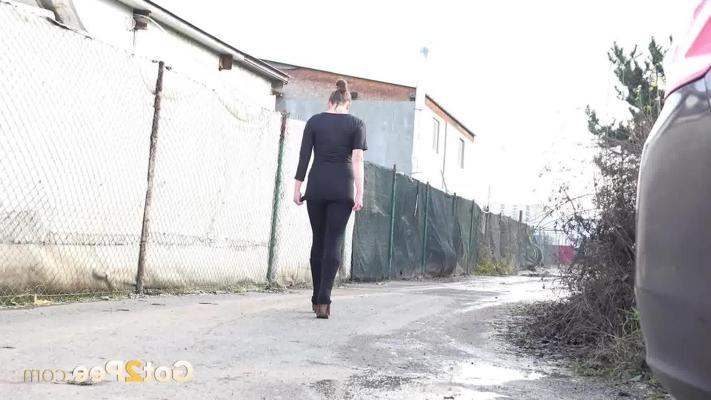 15P Caucasian girl Valentina Ross pees in a puddle during the day