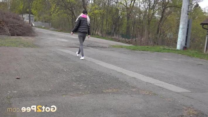 15P Blonde girl Mistica pulls down black denim pants to pee beside railway tracks