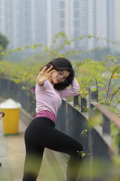 20P Small Asian babe with glasses Irena poses in her lovely outfit outside