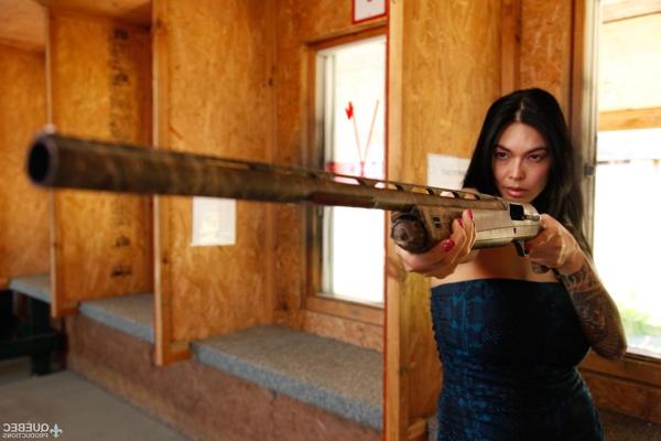 17P Sexy Tera Patrick holding her revolver & showing her big guns and big boobs