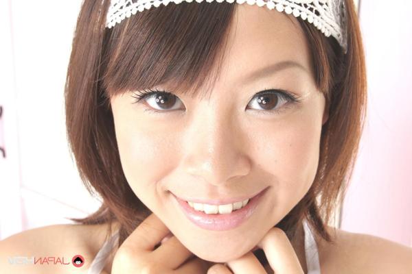 15P Adorable Japanese girl Saki Aimi frees her tits from a bikini top