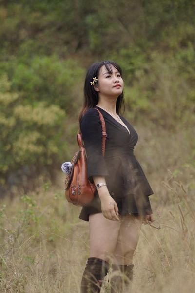 20P Gorgeous Asian babe posing in her black dress and boots in nature