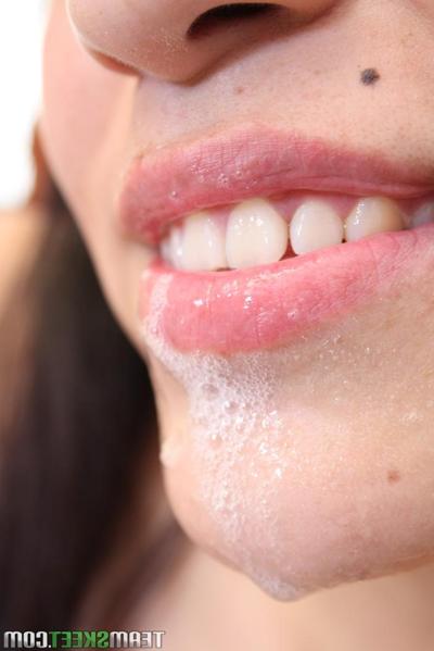 20P Naturally busty teen Sharon Hernandez catches a bubbly facial in MMF threesome