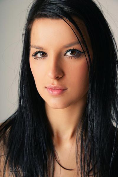 20P Black haired teen Katie drops her clothes and poses naked in a solo