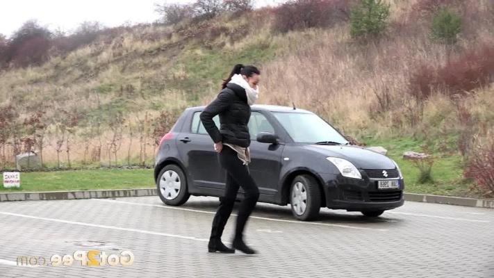 15P Solo girl Eveline Neill squats for a piss in a parking lot in winter clothing