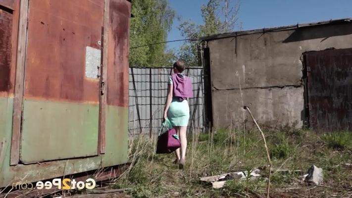 15P Short haired girl Mariam takes a badly needed pee behind a shed