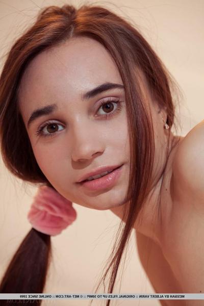 18P Nice teen Messiah wears her long hair in pigtails while taking off her clothes