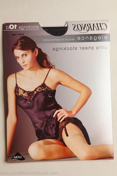 20P Beauty Nelly peels off nightgown and exposes her legs in nylon stockings