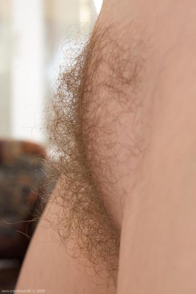 18P Redhead chick Milly presents her bushy pussy in a close up solo scene