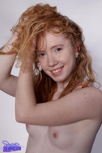 20P Petite curly haired redhead Nicki Blue flaunts her bush on a fitness ball