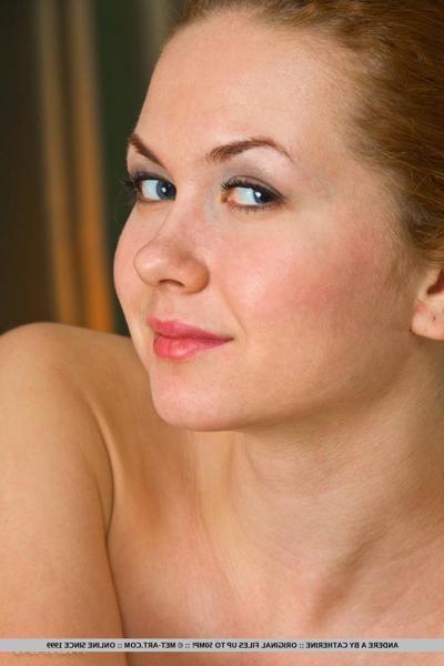 18P Petite redhead Andere A wears her hair up while confidently modeling naked