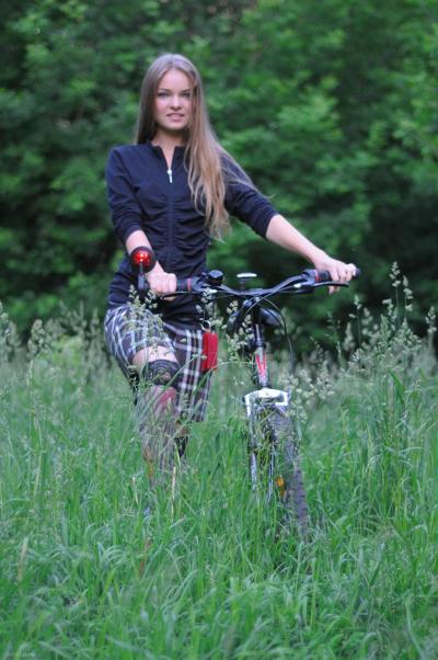 20P Gorgeous teen babe Bridgit A riding her bicycle pantyless in nature