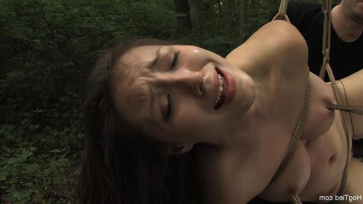 20P Naked brunette Sister Dee endures orgasmic punishment in rope bondage outdoors