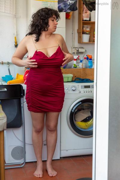 20P Chubby amateur babe Emily V gets spied on while dressing in the laundry room