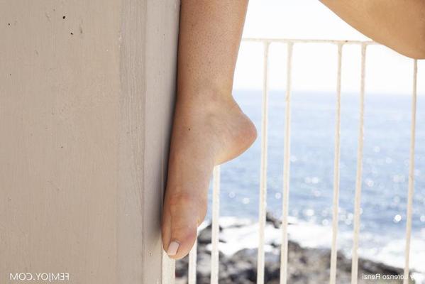 16P Beautiful blonde teen does away with a short dress to go nude on a balcony