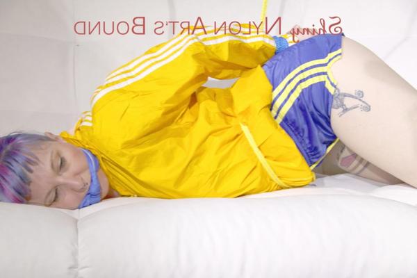 16P Fair skinned girl is left tied up and gagged in nylon athletic wear