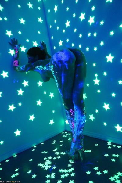 20P Hot solo girl Angel Dark poses naked in body paint in a dark room