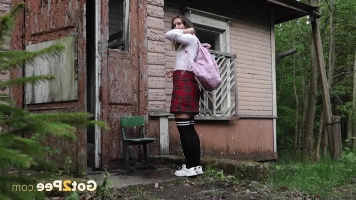 15P Nice girl Rita gets caught taking a piss outside of a rustic dwelling