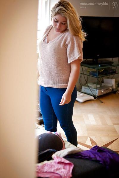16P Chubby chick Leah K dressing her fat rolls after posing in the nude