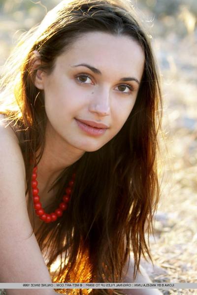 18P Teen model Ilona B poses nude in pigtails high above ocean waters
