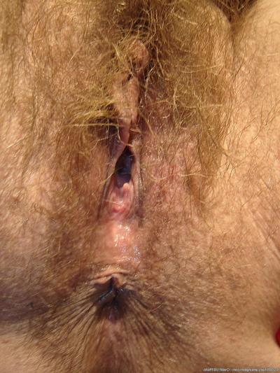 20P Horny fatty Amber shows her hairy pussy up close while toying with a dildo