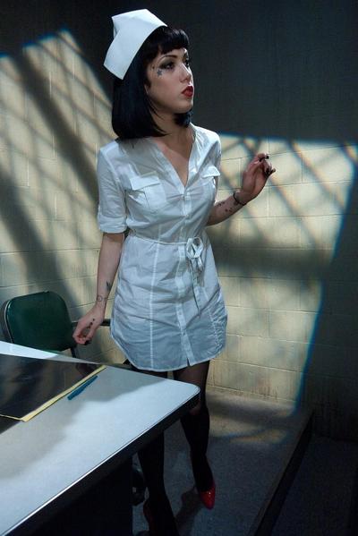 20P Slutty dark haired nurse shows her amazing ass and big tits at the hospital