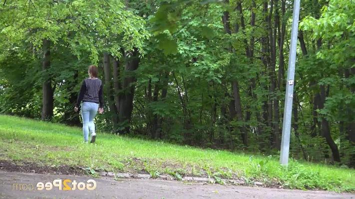 15P Caucasian girl Naomi Bennet ducks behind a concrete wall for a much needed pee