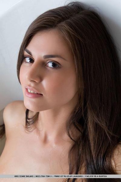 18P Pigtail adorned brunette Astrud A showing off trimmed twat in bathroom