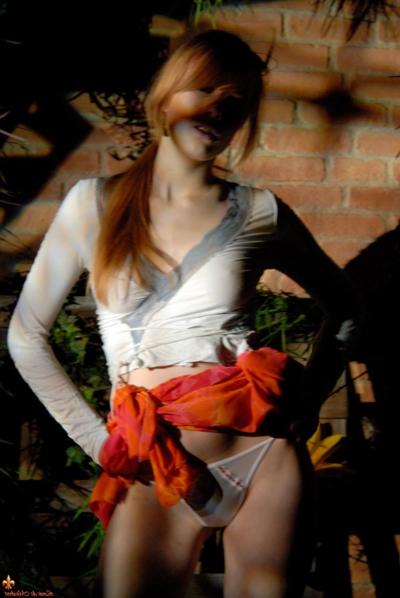 16P Natural redhead Lina exposes her upskirt underwear near a brick wall