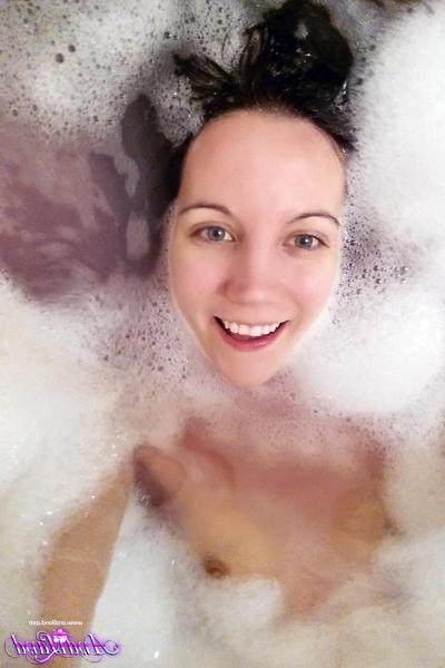 15P Naked teen Andi Land takes self shots during the course of a bubble bath