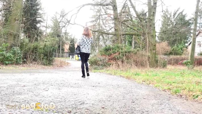 15P Nice girl Cynthia Vellons pulls down her black leggings to pee against a tree