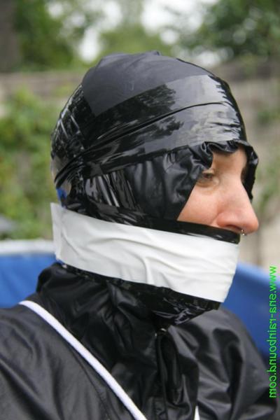 16P Amateur woman Sandra is gagged and tied to a pool in a raincoat