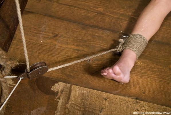 20P Tiny boobed brunette Wenona engages in intense wet bondage action