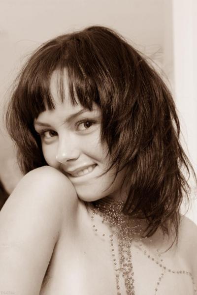 20P Gorgeous teen Mirelle A teases with her big tits and hairy twat on a sofa