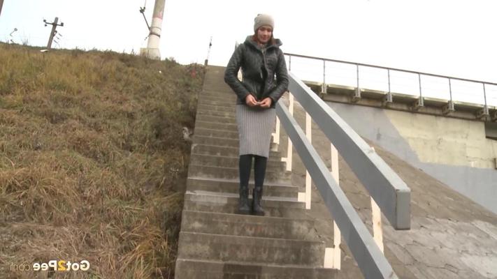 15P Nice girl Kristel hikes up her skirt to pee on a flight of outdoor steps