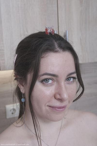 20P Brunette Russian Ally Breelsen strips in the kitchen and rubs her hairy twat
